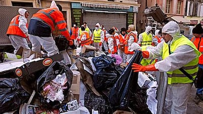 Municipal workers clean rubbish at the end of a strike by rubbish collectors in Marseille.