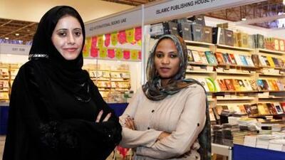 Mariam al Saedi, left, and Rania Mamoum have taken part in workshops sponsored by Sheikh Hamdan bin Zayed Al Nahyan. Their work was celebrated yesterday at the Sharjah International Book Fair.