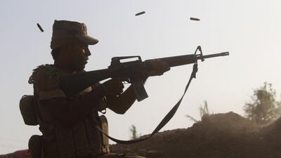 A member of the Iraqi pro-governement forces on a front line in the Albu Huwa area, south of Fallujah during an operation aimed at retaking areas from ISIL. Modah Al Dulaimi / AFP