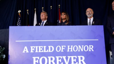 Trump and Melania stand together at the start of the 17th annual September 11 observance. Reuters