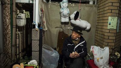 A trader sells secondhand goods at Boroichi flea market in Tokyo. Thomas Peter / Reuters