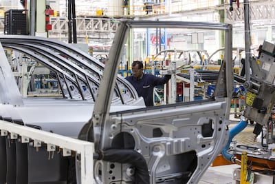 An employee assembles door plates for Mahindra & Mahindra Ltd. XUV 500 sport-utility vehicles (SUV) on the production line at the company's facility in Chakan, Maharashtra, India. Photographer: Udit Kulshrestha/Bloomberg