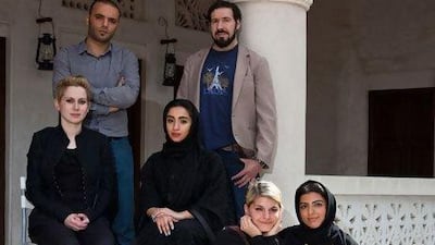 On the steps of their studio space in Al Bastakiya are, from left: the curator Alexandra MacGilp, and artists in residence Magdi Mostafa, Zeinab Al Hashemi, Fayçal Baghriche, Deniz Üster and Hadeyeh Badri.