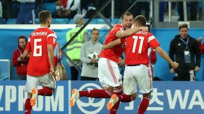 Russia players celebrate the first of their goals against Egypt. Pilar Olivares / Reuters