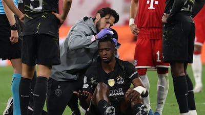 PSG defender Willian Pacho receives treatment for a head injury. AFP