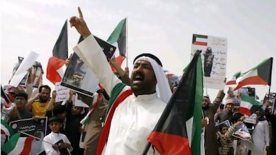Hundreds of stateless Arabs demonstrate to demand citizenship and other rights before Kuwait's anti-riot police uses tear gas to disperse them in Jahra, 50kms west of Kuwait City.