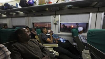 Back to the grind. Salama rides a train back to Cairo.