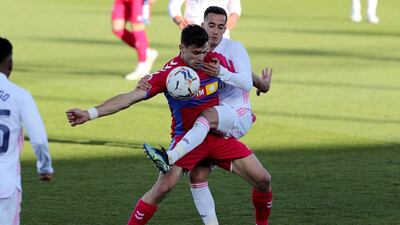 Real Madrid's striker Lucas Vazquez vies for the ball with Elche's striker Lucas Boye. EPA