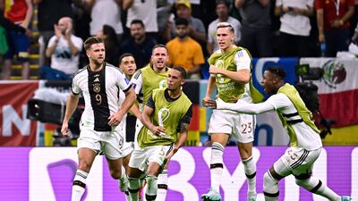 Fullkrug celebrates with the German squad. AFP