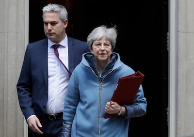 Britain's Prime Minister Theresa May and Brexit Secretary Stephen Barclay leave 10 Downing Street in London, Monday, March 25, 2019. AP