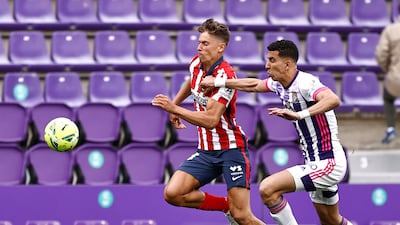 Atletico Madrid's Marcos Llorente with Real Valladolid's Jawad El Yamiq. Reuters
