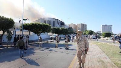 Security forces stand at the site of the headquarters of Libya's foreign ministry after suicide attackers hit in Tripoli, Libya. Reuters