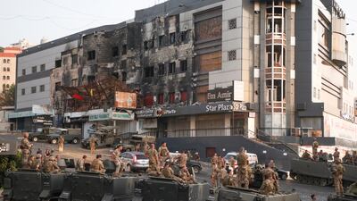 Lebanese soldiers take up position in Khalde, 12km south of Beirut, after a gun attack on a Hezbollah funeral on Sunday.
