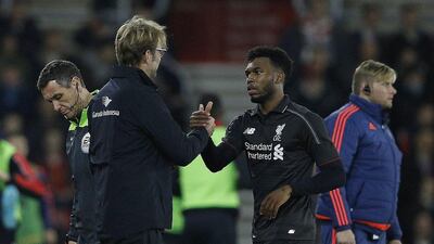 Liverpool manager Jurgen Klopp shakes hands with Daniel Sturridge during their League Cup win on Wednesday night at St Mary’s Stadium. Adrian Dennis / AFP