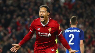 Virgil van Dijk celebrates scoring the winning goal for Liverpool on debut against Everton. Clive Brunskill / Getty Images