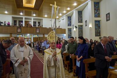 Louis Sako, centre, patriarch of Iraq's Chaldean Catholic Church, holding Easter mass at Mar Youssif Chaldean Church in Baghdad. AP