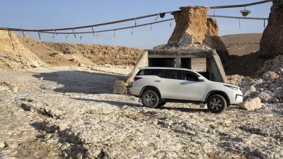 Locals are using the riverbed while the bridge is damaged. This photo shows the height of the bridge. Antony Hansen for The National