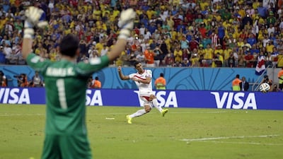 Costa Rica goalkeeper Keylor Navas, near, reacts as Michael Umana takes the winning penalty kick in the shootout victory over Greece at the 2014 World Cup round of 16 on Sunday night in Recife, Brazil. Ricardo Mazalan / AP / June 29, 2014