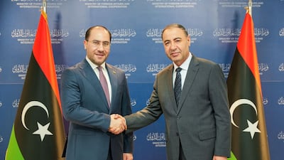 Iraqi Charge d'Affaires Ahmed Al Sahaf, left, shakes hands with Libyan Foreign Minister Taher Salem Al Baour. Photo: Ahmed Al Sahaf