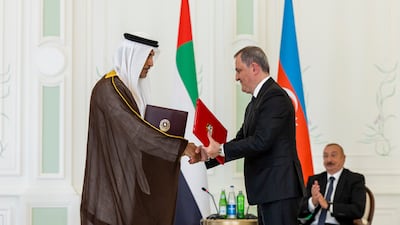 Saeed Al Hajeri, Minister of State, and Jeyhun Bayramov, Minister of Foreign Affairs of Azerbaijan, exchange a memorandum of understanding at the administrative building of the Special Representative Office during an official visit to Azerbaijan. Ryan Carter / UAE Presidential Court