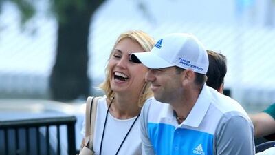 Sergio Garcia rides with girlfriend Katharina Boehm during a practice round prior to the start of the 96th PGA Championship at Valhalla Golf Club on Wednesday in Louisville, Kentucky. David Cannon / AFP