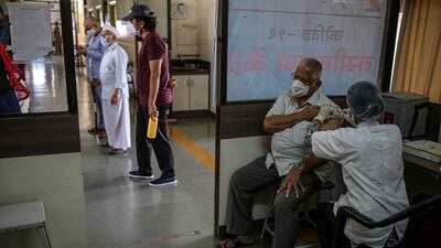 A nurse administers a dose of Covaxin at a vaccination centre inside a municipal hospital in Pune, Maharashtra, India, on Wednesday, May 5, 2021. Bloomberg