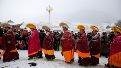 Tibetan monks attend a ceremony at the Langmu Lamasery during the 'Sunbathing Buddha Festival'. Reuters