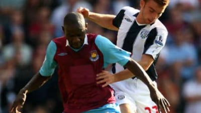 West Ham's Herita Ilunga holds off West Brom's James Morrison during Saturday's Premier League game, the first time since the league was formed in 1992 that neither side had a shirt sponsor.