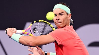 Rafa Nadal hits a return against Dominic Thiem. AFP