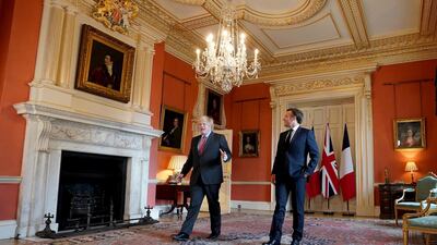 Britain's Prime Minister Boris Johnson welcomes French President Emmanuel Macron to commemorate the 80th anniversary of wartime leader Charles de Gaulle's BBC broadcast to occupied France after the 1940 Nazi invasion, in 10 Downing Street in London. EPA