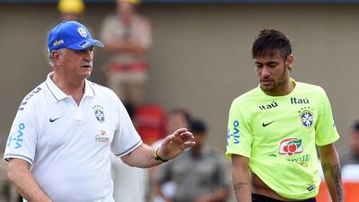 Brazilian head coach Luiz Felipe Scolari spekas with forward Neymar during a national team training session in Serra Dourada Stadium in Goiania on Monday. Evaristo SA / AFP / June 2, 2014