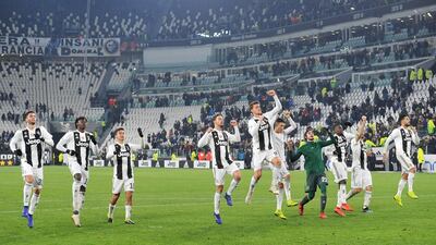 Juventus players acknowledge their fans after triumphing against Chievo. EPA