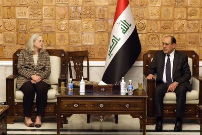 Former Iraqi prime minister Nouri Al Maliki meets with US Ambassador Alina Romanowski in Baghdad on Sunday. AFP
