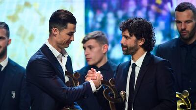 Cristiano Ronaldo receives from President AIC, Damiano Tommasi, the award of best player at Gran Gala del Calcio 2019 ceremony. AFP