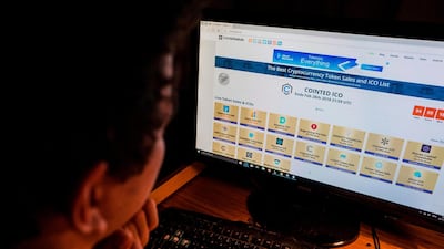 A computer screen displays a site featuring ICO listings in Berlin. AFP