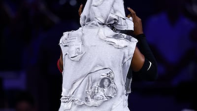 Naomi Osaka walked onto the court at the 2026 US Open wearing a custom all-white Who Decides War gown decorated with news clippings of her career highlights. AFP