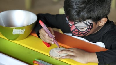 Four-year-old Raiden paints.