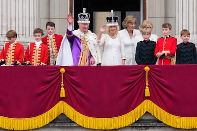 King Charles III and Queen Camilla wave to the crowds from the balcony of Buckingham Palace after their coronation ceremony. AP Photo / Petr David Josek