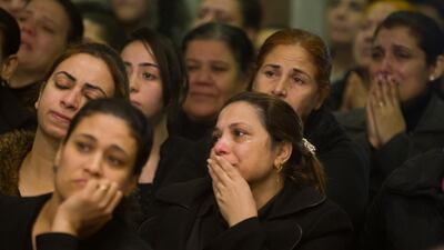 Relatives of Coptic Christians grieve as during the funeral service of victims of the attacked on Mar Mina church in Cairo, Egypt. AP / Amr Nabil