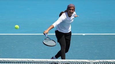 Meshkatolzahra Safi plays a backhand volley to Anja Nayar. Getty Images