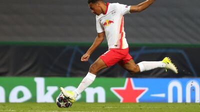 Leipzig's US midfielder Tyler Adams shoots to score his goal during the Champions League quarter-final against Atletico Madrid. AFP