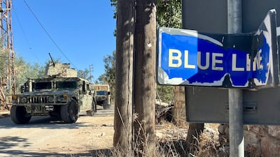 Lebanese army soldiers stand guard at the site where Lebanese municipal employee Ibrahim Salameh was killed in the village of Blida in southern Lebanon, on October 30. EPA