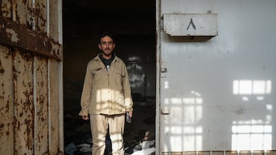 Emad Al Razzouk, a former inmate at Sednaya, in the clothes he wore when he was detained. Ahmad Fallaha for The National