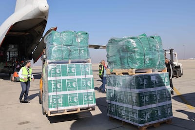 Humanitarian aid sent by Saudi Arabia is unloaded at Damascus airport on January 1. AFP