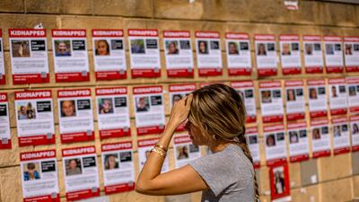 Pictures of hostages held in Gaza by Hamas militants, outside the Israeli military base of The Kirya, Tel Aviv. EPA