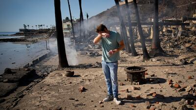 Luke Dexter stands amid the remains of his father's beachfront property following the Palisades fire in Malibu, California, US. AP Photo