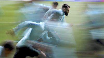 A picture taken with a slow shutter speed shows Australian national soccer team’s players in action during a training session in Melbourne, Australia. Australia will play against Japan in a 2018 Fifa World Cup Russia qualification soccer match at the Etihad stadium in Melbourne. Joe Castro / EPA