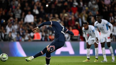Paris Saint-Germain's Kylian Mbappe scores a penalty to make it 2-1 against Marseille in first-half injury time. The match would finish with the same scoreline. AFP
