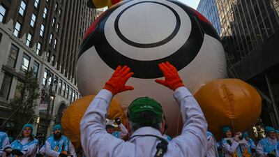 Balloon handlers deflate the balloons after. The annual Macy’s parade includes 16 giant character balloons, 28 floats, and 12 marching bands. AFP