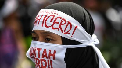 A protester wears headbands reading "No to Icerd" during a rally organised by Muslim politicians against the signing of the UN anti-discrimination convention (ICERD) at Merdeka Square in Kuala Lumpur. AFP